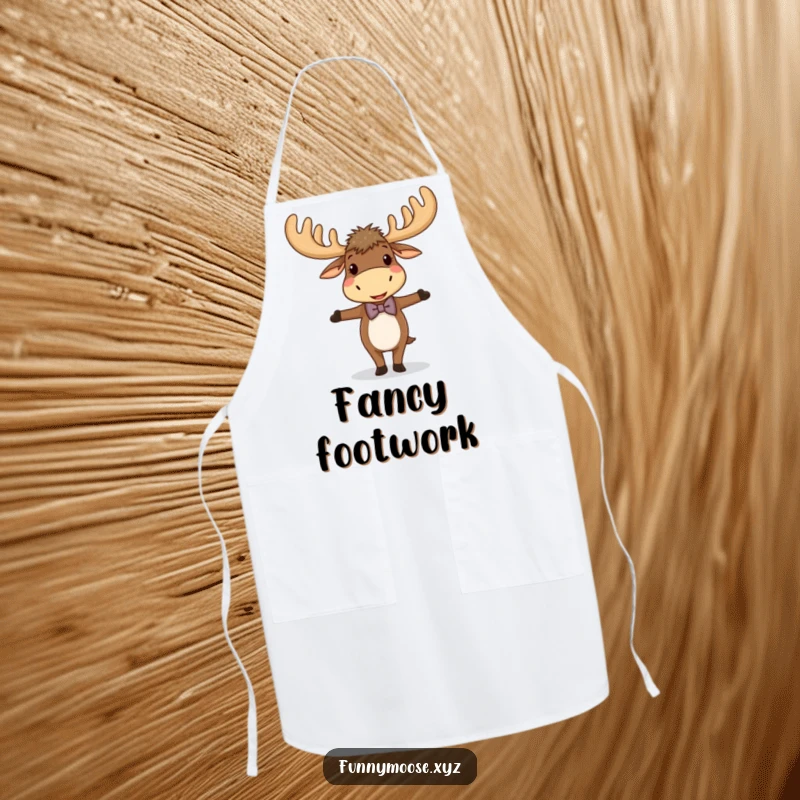 Funny apron featuring a giggling moose with large antlers and a bowtie, balancing expertly, ideal for kitchen fun.