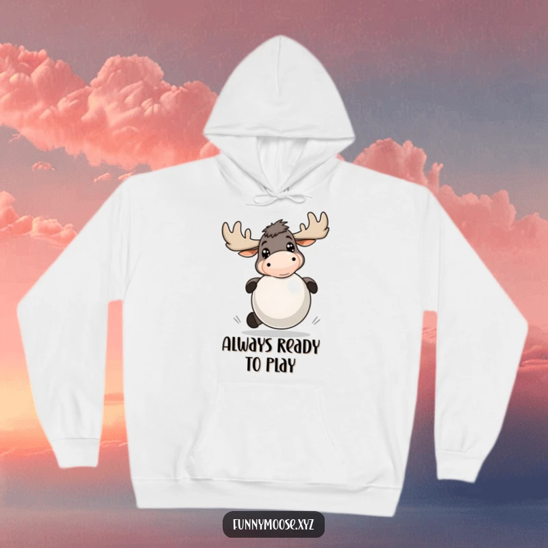 Funny hoodie with an energetic moose, bright eyes, playfully bouncing a large ball, offering warmth and humor.
