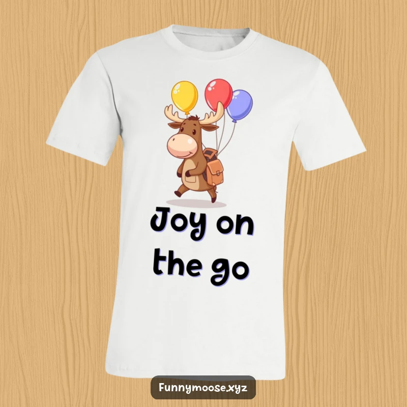 Funny moose t-shirt with a small backpack juggling colorful balloons, perfect for fans of playful and adventurous themes.