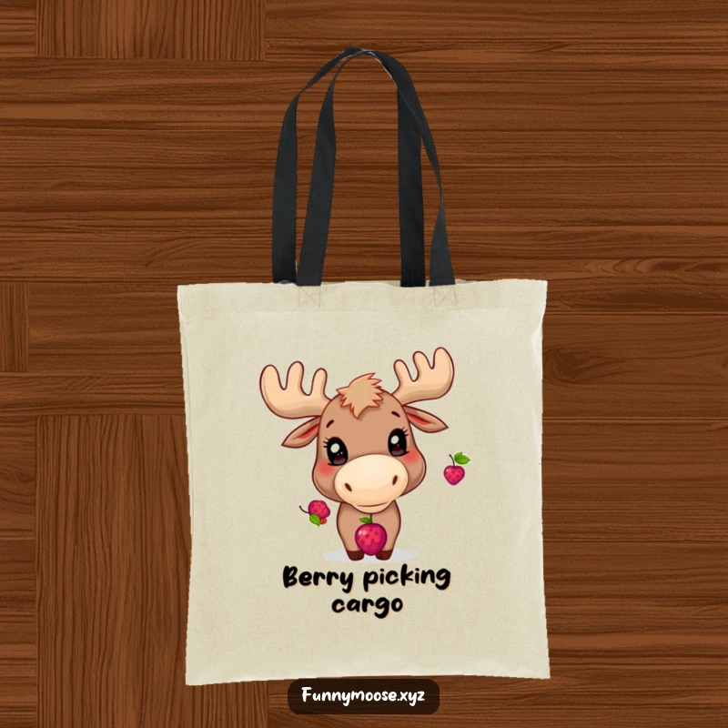 Funny tote bag depicting a playful moose with bright eyes, focused on balancing a berry on its nose.